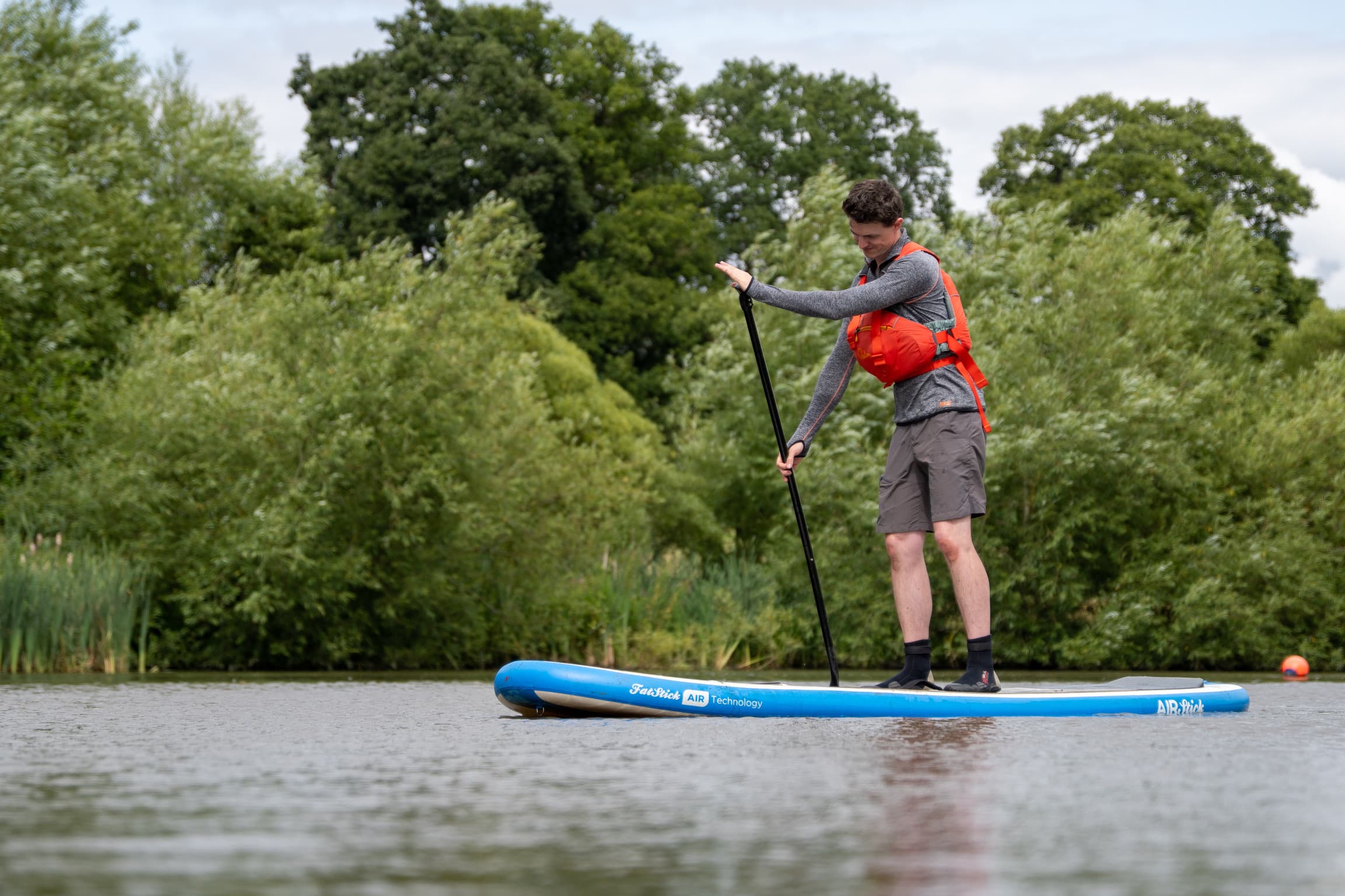 man paddleboarding sup